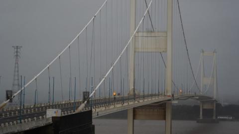 The large M48 Severn Bridge crossing the river on a grey rainy day.