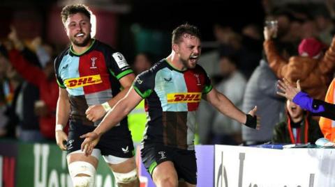 Sam Riley celebrates scoring a try for Harlequins