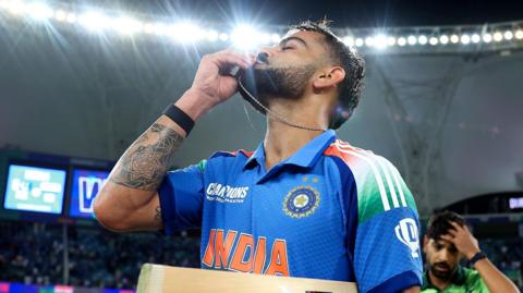 Virat Kohli celebrates