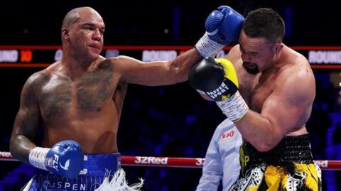 Fabio Wardley throws a punch at Joseph Parker