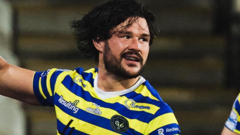 James Bentley celebrates while playing for Warrington Wolves