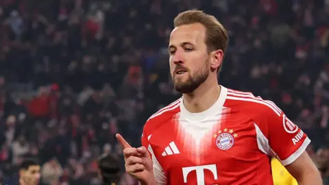 Harry Kane celebrates scoring