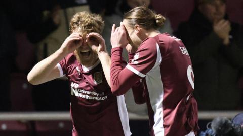 Cameron McGeehan (left) celebrates a goal for Northampton