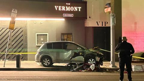 A vehicle that plunged into a crowd outside a nightclub, injuring dozens, is seen on Santa Monica Boulevard in the East Hollywood neighborhood of Los Angeles, California, U.S.