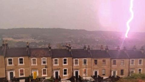 Lightning strikes near a row of houses in Bath, Somerset