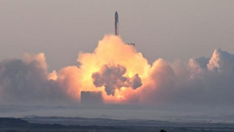 Starship taking off in a blaze of clouds