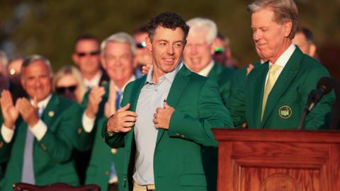 Fred Ripley awards Rory McIlroy with the Green Jacket after the final round of the 2026 Masters tournament.