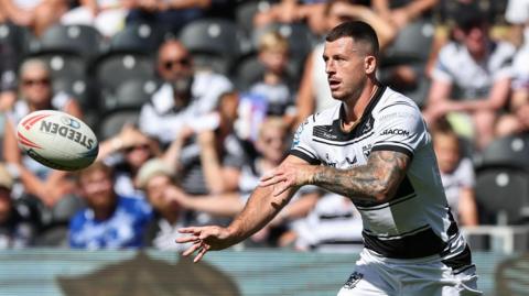Hull FC player Cade Cust throwing a pass during their recent game with Salford Red Devils at MKM Stadium  