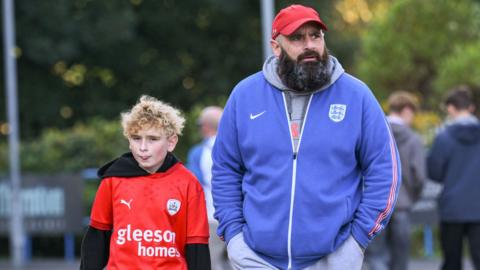 Barnsley fans arrive at Huddersfield's John Smiths' Stadium