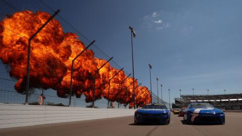 Denny Hamlin, driver of the Progressive Toyota, and Kyle Larson, driver of HendrickCars.com Chevrolet, lead the field on a pace lap prior to the NASCAR Cup Series Enjoy Illinois 300 at WWT Raceway in Madison, Illinois. Photo by Chris Graythen