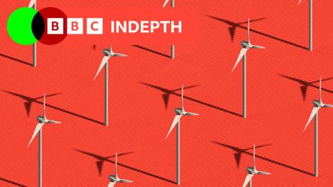 Wind turbines on a red background