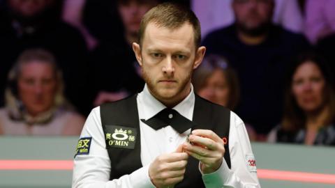 Mark Allen prepares to play a shot at this year's World Championship