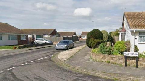 a residential street with modern detached bungalows