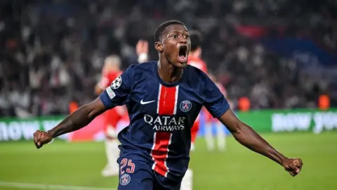 Nuno Mendes celebrates as PSG score against Girona