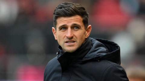 Portsmouth boss John Mousinho looks concerned during the 5-0 defeat at Bristol City
