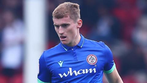 Ben Woods in action for Accrington against Walsall in April 2025