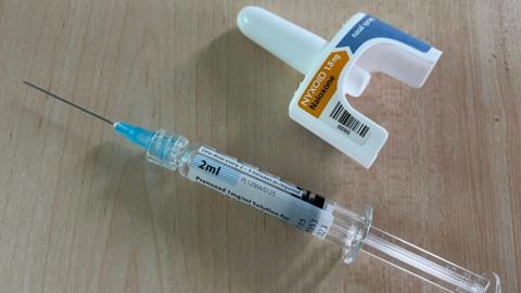 A syringe and a nasal spray containing naloxone, which is an antidote to opiod overdoses