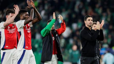 Arsenal players and Mikel Arteta applaud fans after win