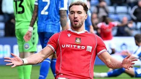 Wrexham striker Sam Smith celebrates