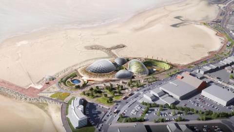 An artist's impression of a beach from above. Large glass domes surrounded by greenery and gardens are on the beach. 