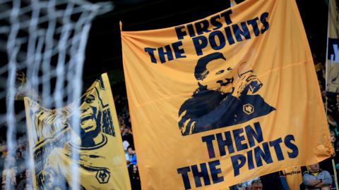 "First the Points, then the pints" flag at Molineux 