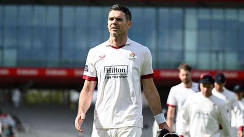 James Anderson of Lancashire leads his team from the field after winning the Rothesay County Championship Division 2 match between Lancashire and Derbyshire at Emirates Old Trafford on April 13, 2026 in Manchester, England.