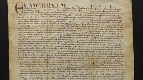 A parchment charter written in Latin calligraphic script