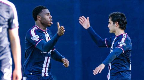 Dundee's Tony Yogane and Yan Dhanda celebrate