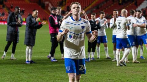 Portsmouth's Terry Devlin leads the celebrations with the Pompey players after the 3-1 win at Charlton