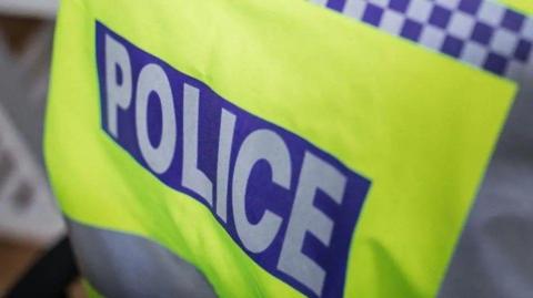 The back of luminous policing uniform