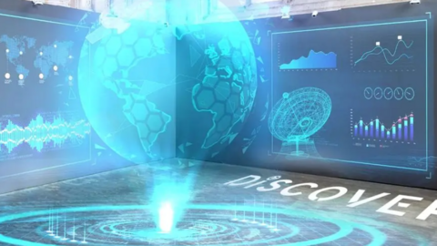 An interactive light display in shades of blue, with a projection in the middle of the world. Discover is written in white light on the floor.