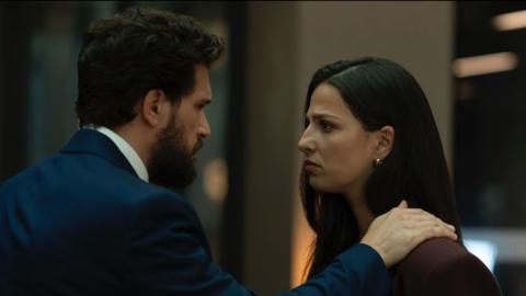 Henry places his hand on Yas's shoulder. They look into each other's eyes