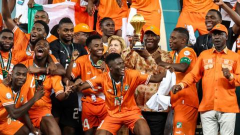 Ivory Coast team celebrate winning AFCON