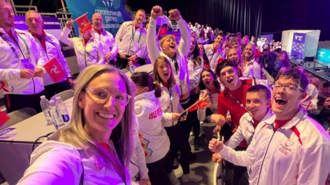 The Manx team inside the venue of the opening ceremony cheering.