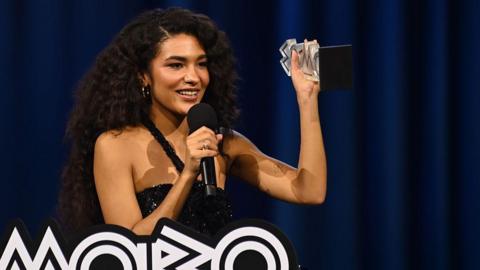 Olivia Dean wins the award for Best Female Act onstage during the 2026 MOBO Awards.