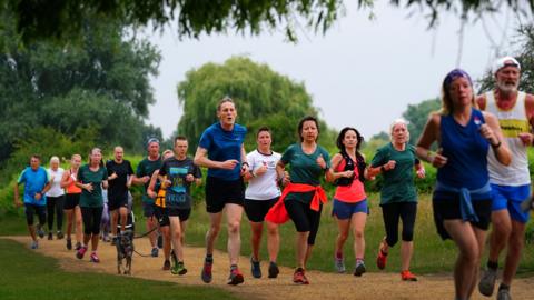 Runners participating in a Parkrun event