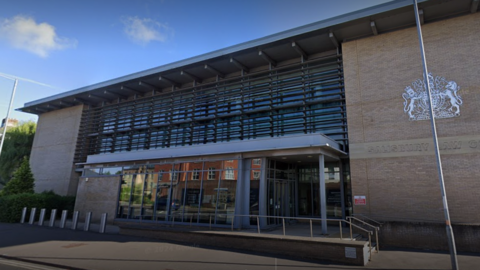 Salisbury Crown Court, a brick building with steps leading to a glass-fronted entrance