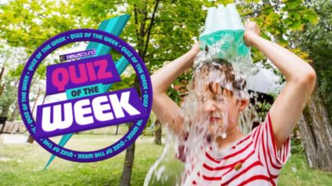 a child pours water over their head from a bucket