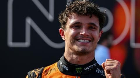 McLaren's Lando Norris clenches his left fist in celebration after winning the Hungarian Grand Prix