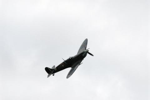 A traditional fly past of a WWII Spitfire, above the annual Proms concert at Stonor Park, Henley-upon-Thames, Oxfordshire.