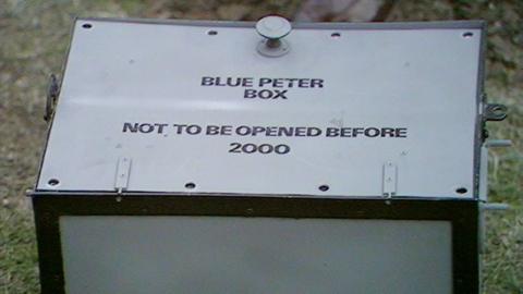 The Blue Peter time capsule - a grey, lead-lined box that says 'Not to be opened before 2000'.