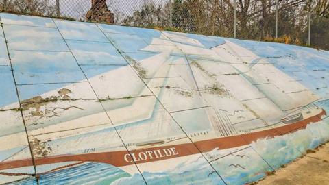 A mural of the Clotilda slave ship