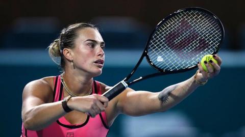 Aryna Sabalenka prepares to serve