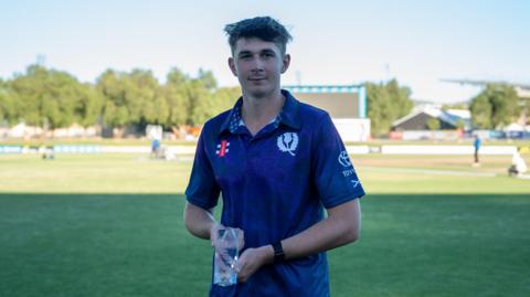 Mackenzie Jones with player of the match trophy