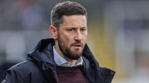 Anthony Limbrick watching a Hartlepool match from the sidelines