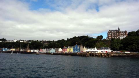A row of brightly coloured houses along the seafront on Tobermory in Mull