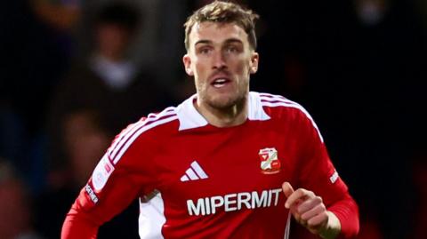 Ryan Delaney tracks play for Swindon Town