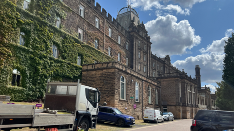 Large grey stone victorian county hall building