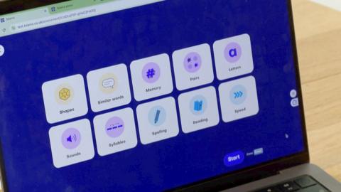 Computer screen with a dark blue background showing 10 boxes, including subjects such as "spelling", "memory" and "reading"