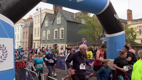 Runners participating in the Bannister Community Mile